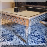 F06. Mirrored top coffee table. 18"h x 40" x 40" 